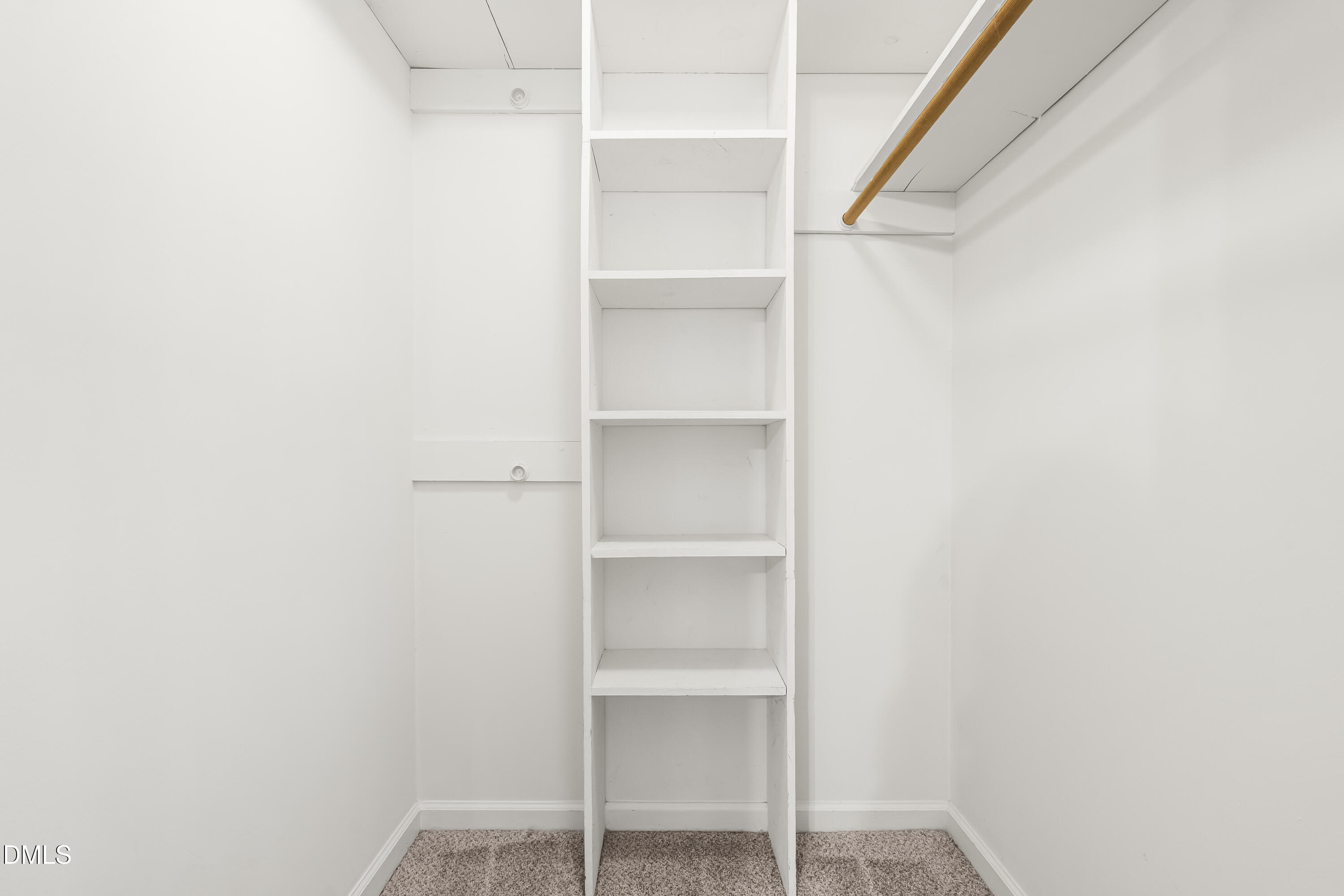 8031 Perry Creek Road Raleigh, NC 27616 - Photo 19 of 28 a view of an empty walk in closet