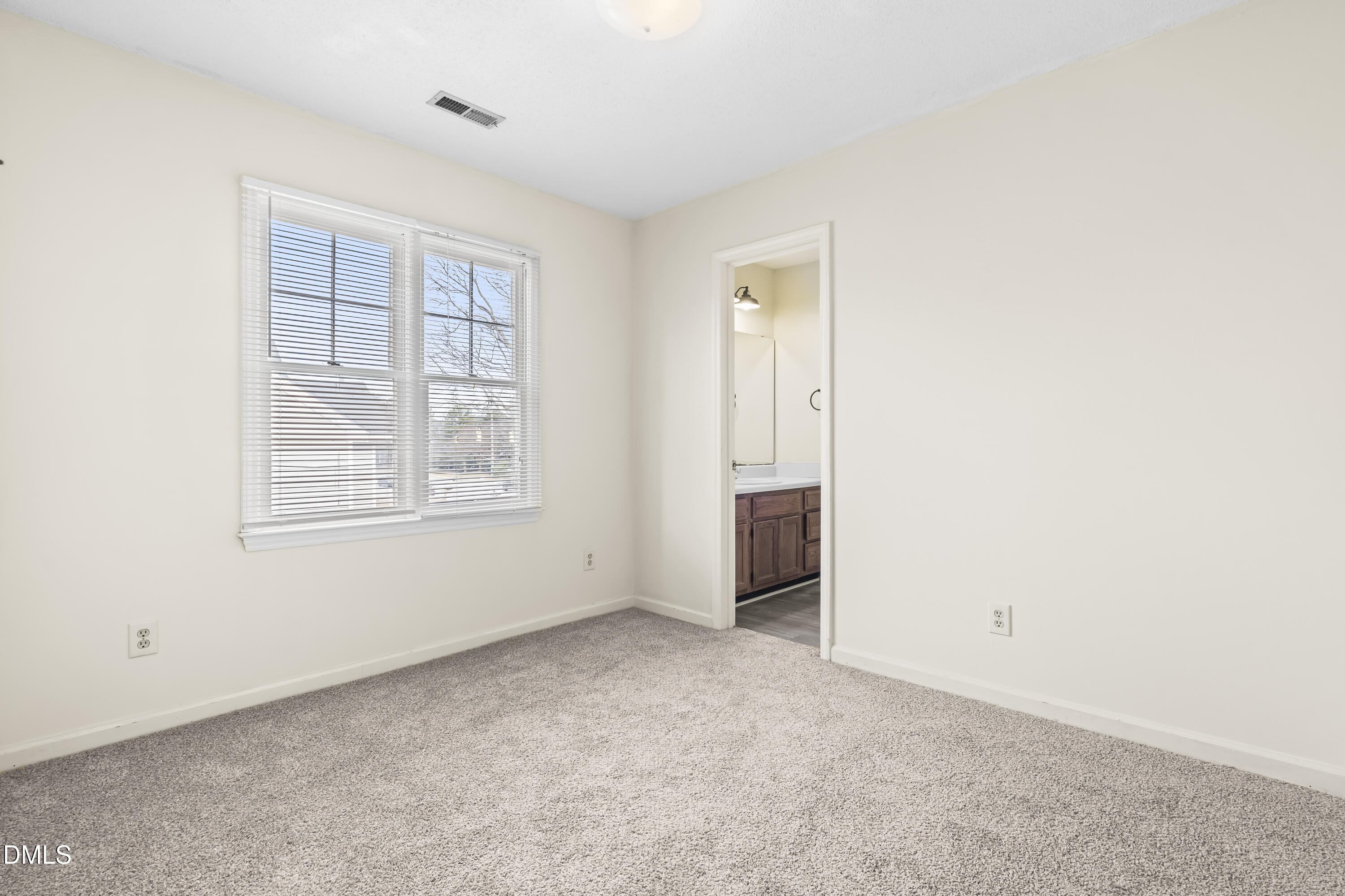 8031 Perry Creek Road Raleigh, NC 27616 - Photo 20 of 28 a view of an empty room with a window