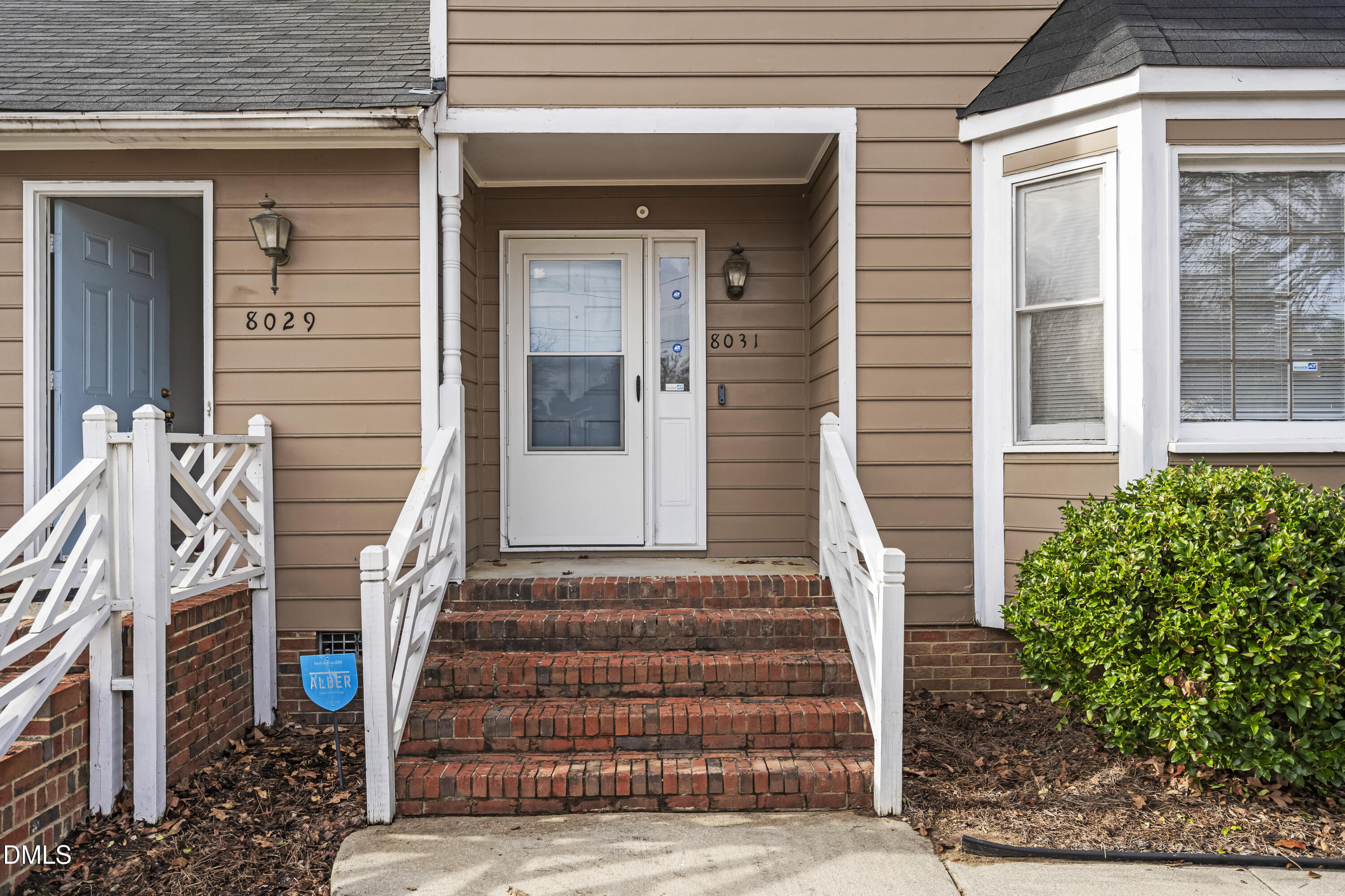 8031 Perry Creek Road Raleigh, NC 27616 - Photo 2 of 28 a front view of a house with a outdoor space