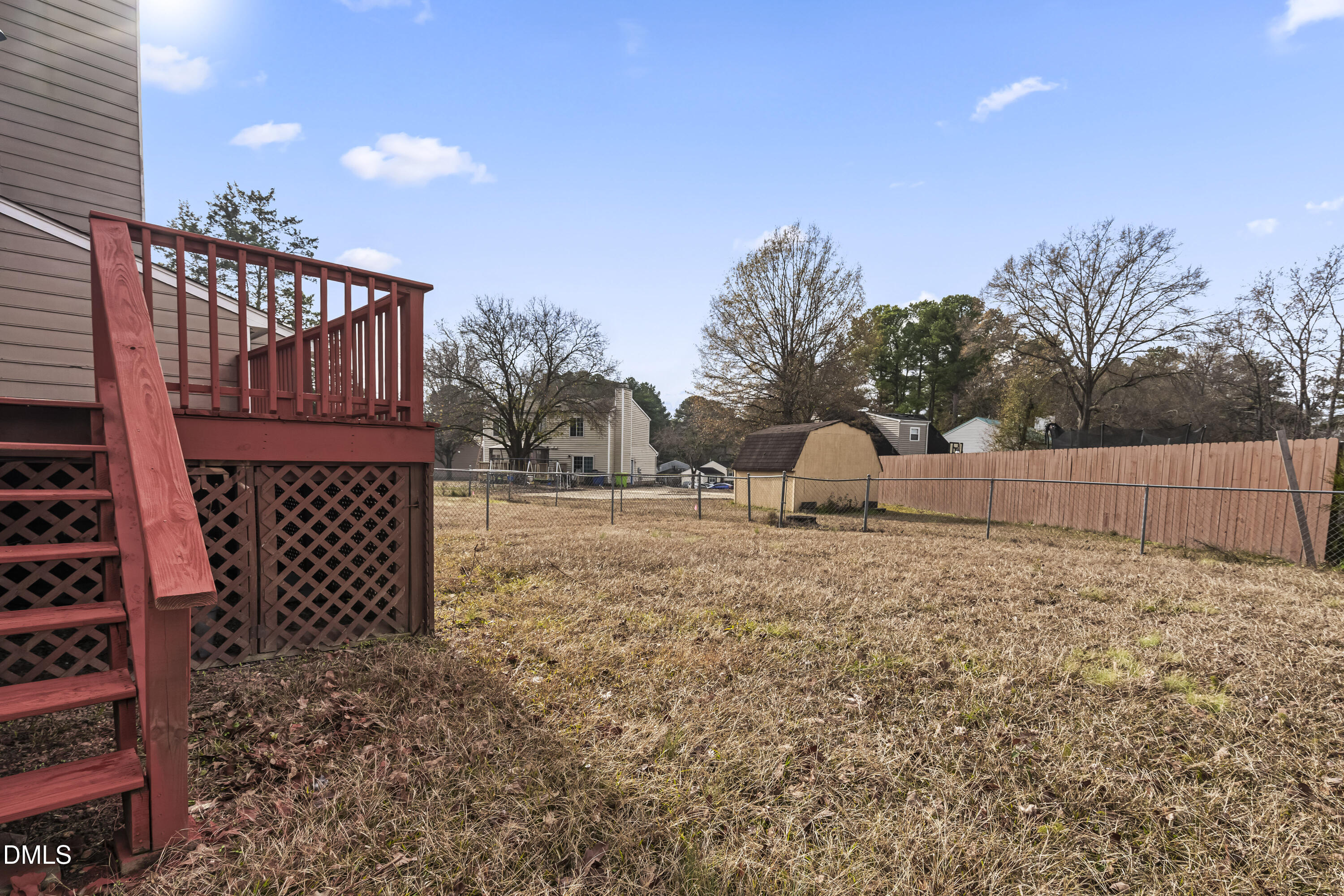 8031 Perry Creek Road Raleigh, NC 27616 - Photo 24 of 28 a backyard of a house with lots of green space