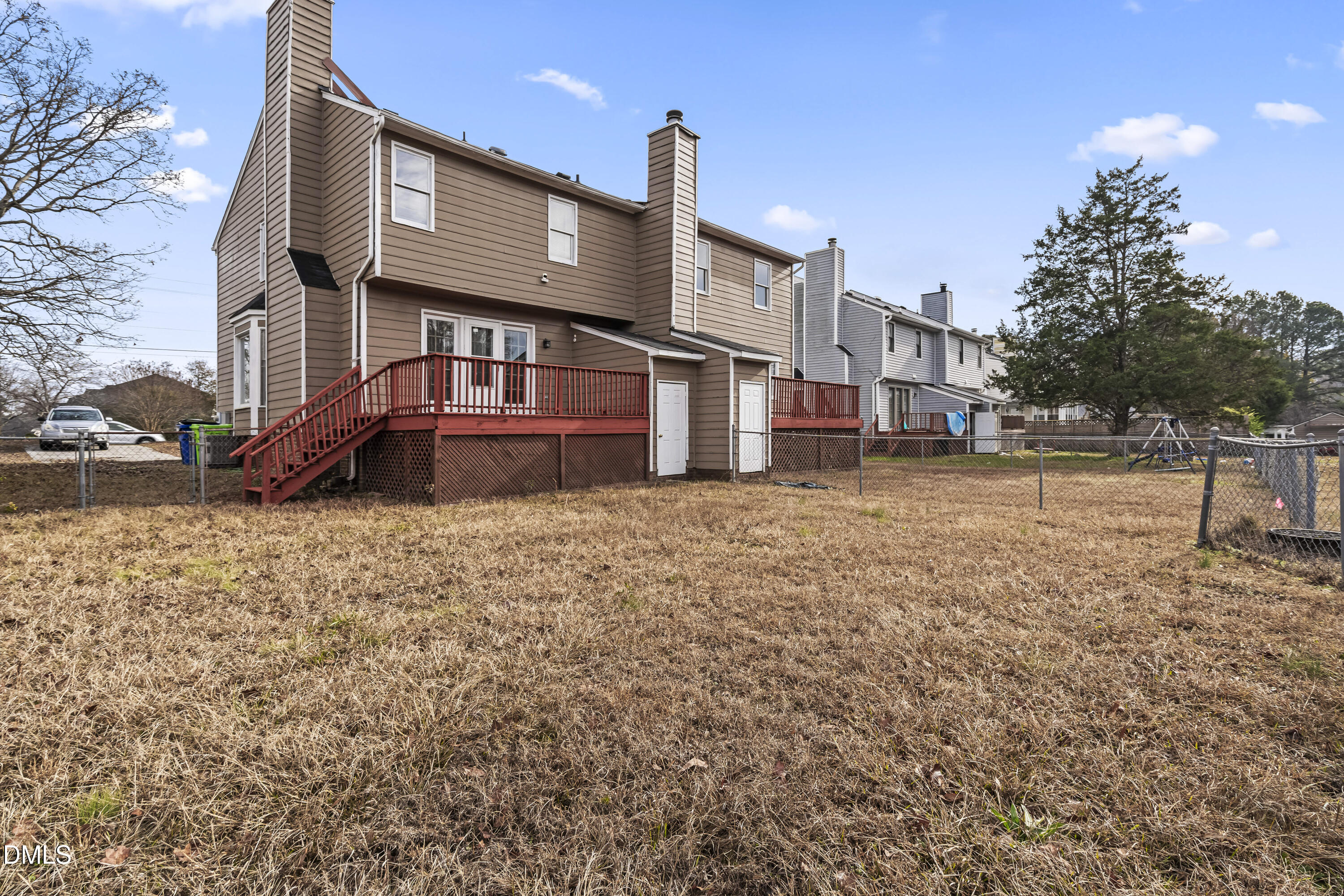 8031 Perry Creek Road Raleigh, NC 27616 - Photo 25 of 28 a view of a house with a yard