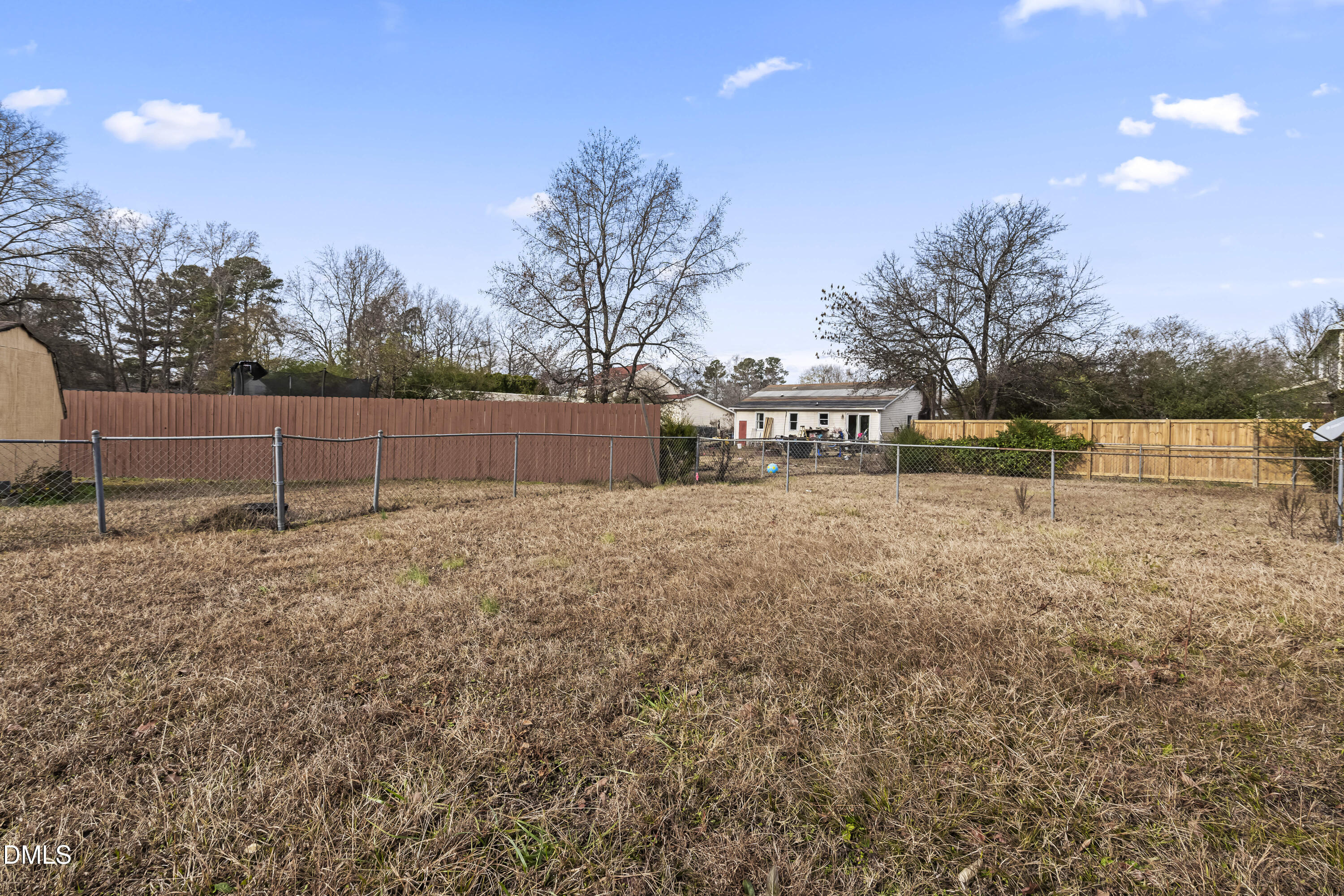 8031 Perry Creek Road Raleigh, NC 27616 - Photo 26 of 28 a view of house with outdoor space and trees in the background
