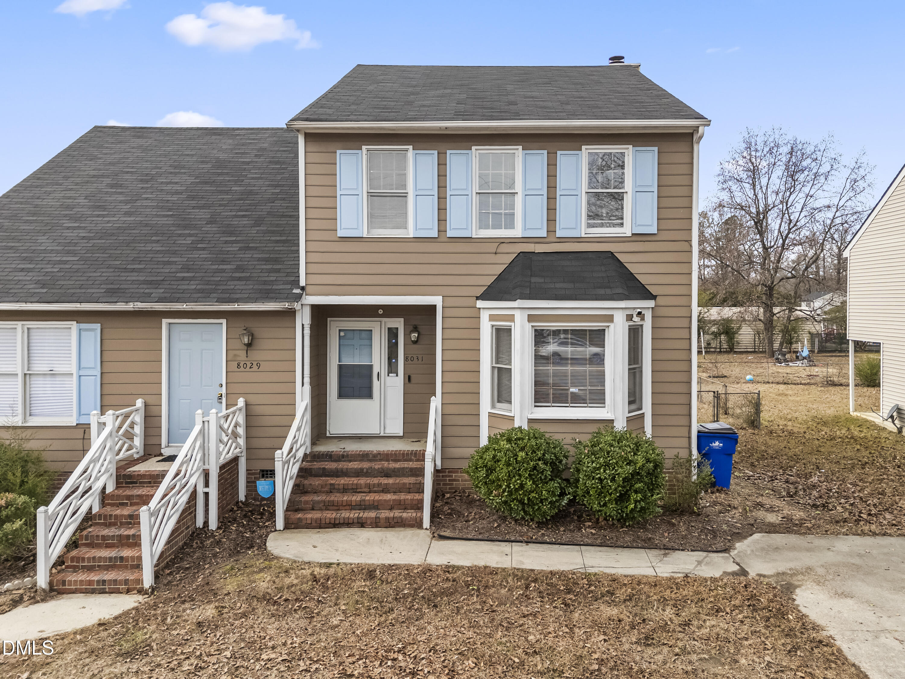 8031 Perry Creek Road Raleigh, NC 27616 - Photo 3 of 28 a front view of a house with a yard