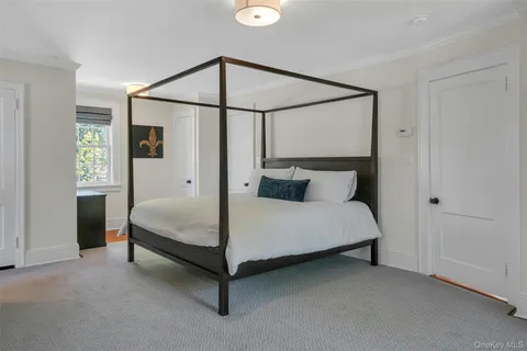 a bed room with a bed and a window