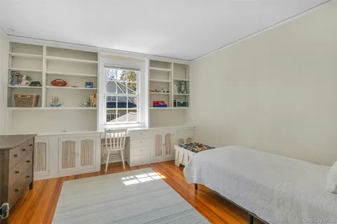 a bed room with a bed and a window