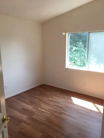 a bathroom with a granite countertop sink a toilet and a bathtub