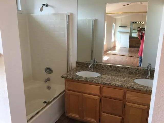 a view of a backyard with pathway