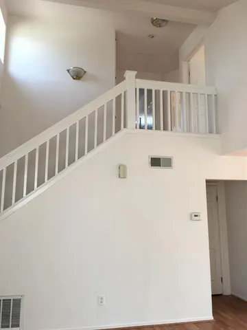 a view of a white house with a window