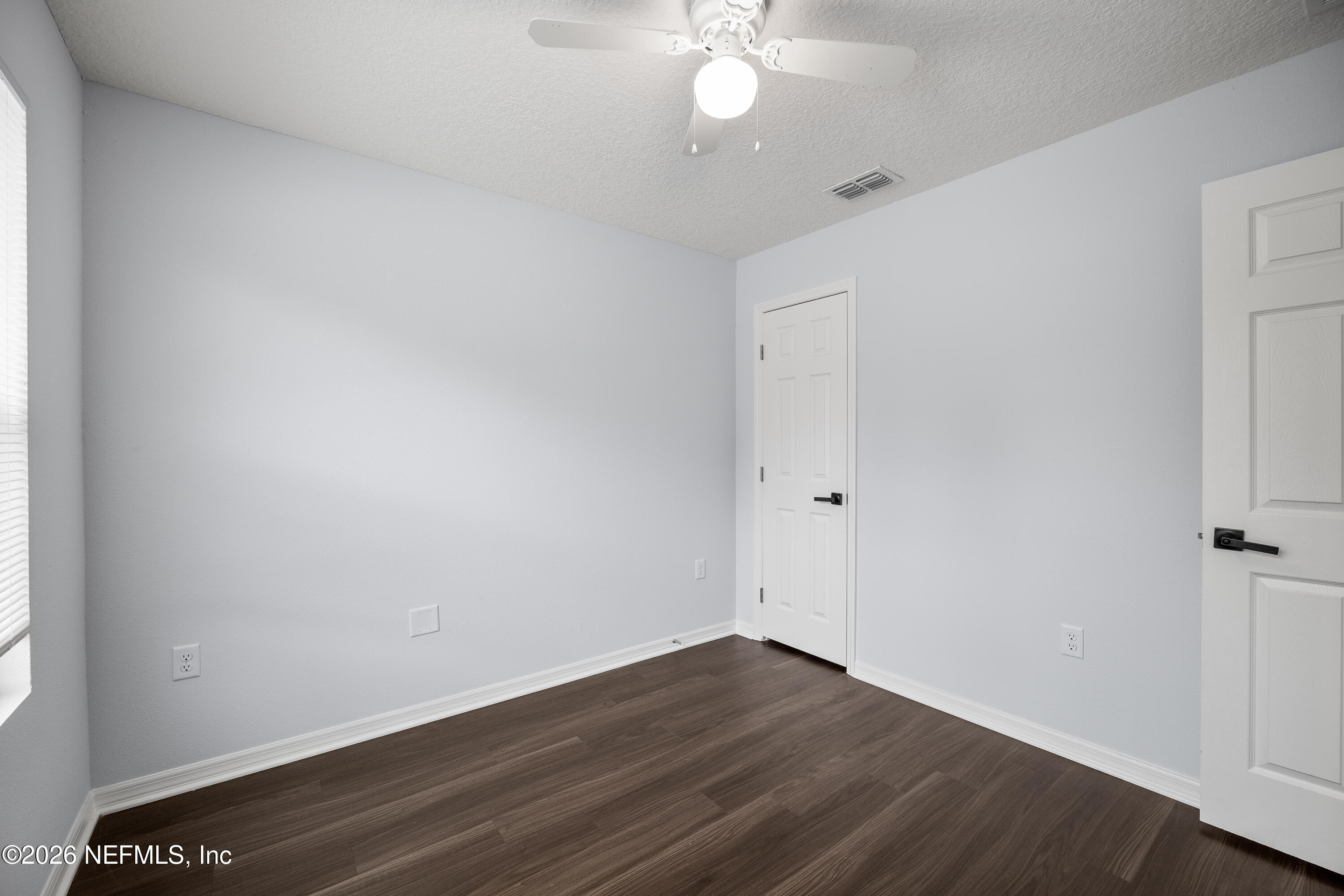 675 Moore Street Baldwin, FL 32234 - Photo 12 of 31 wooden floor in an empty room