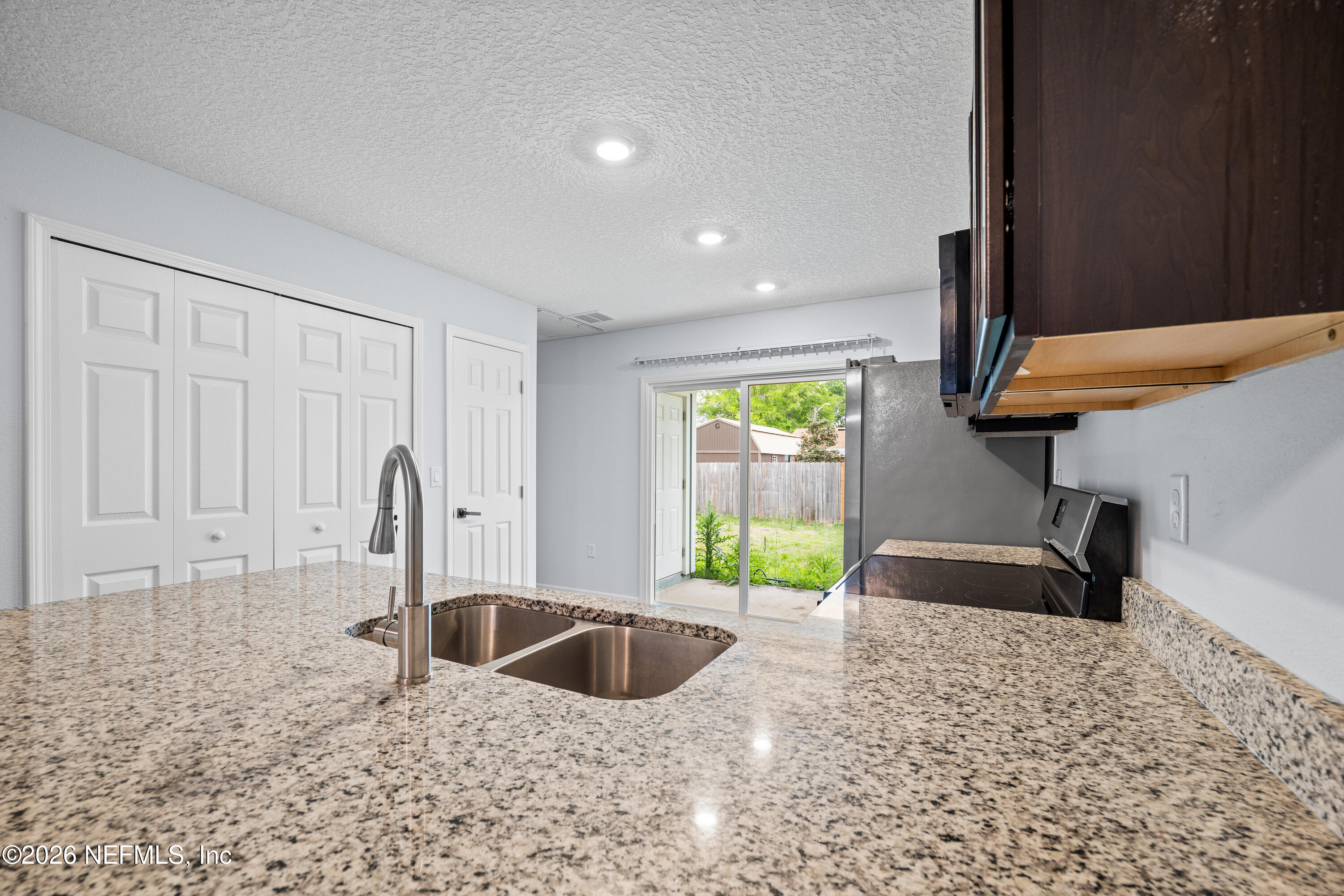 675 Moore Street Baldwin, FL 32234 - Photo 18 of 31 a view of a kitchen and a window