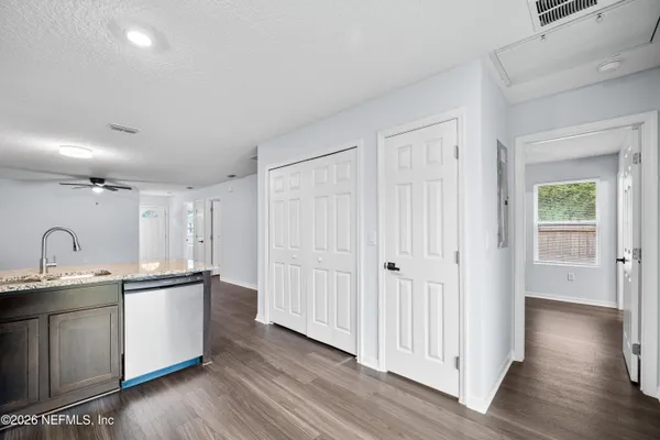 a kitchen with a sink and a refrigerator