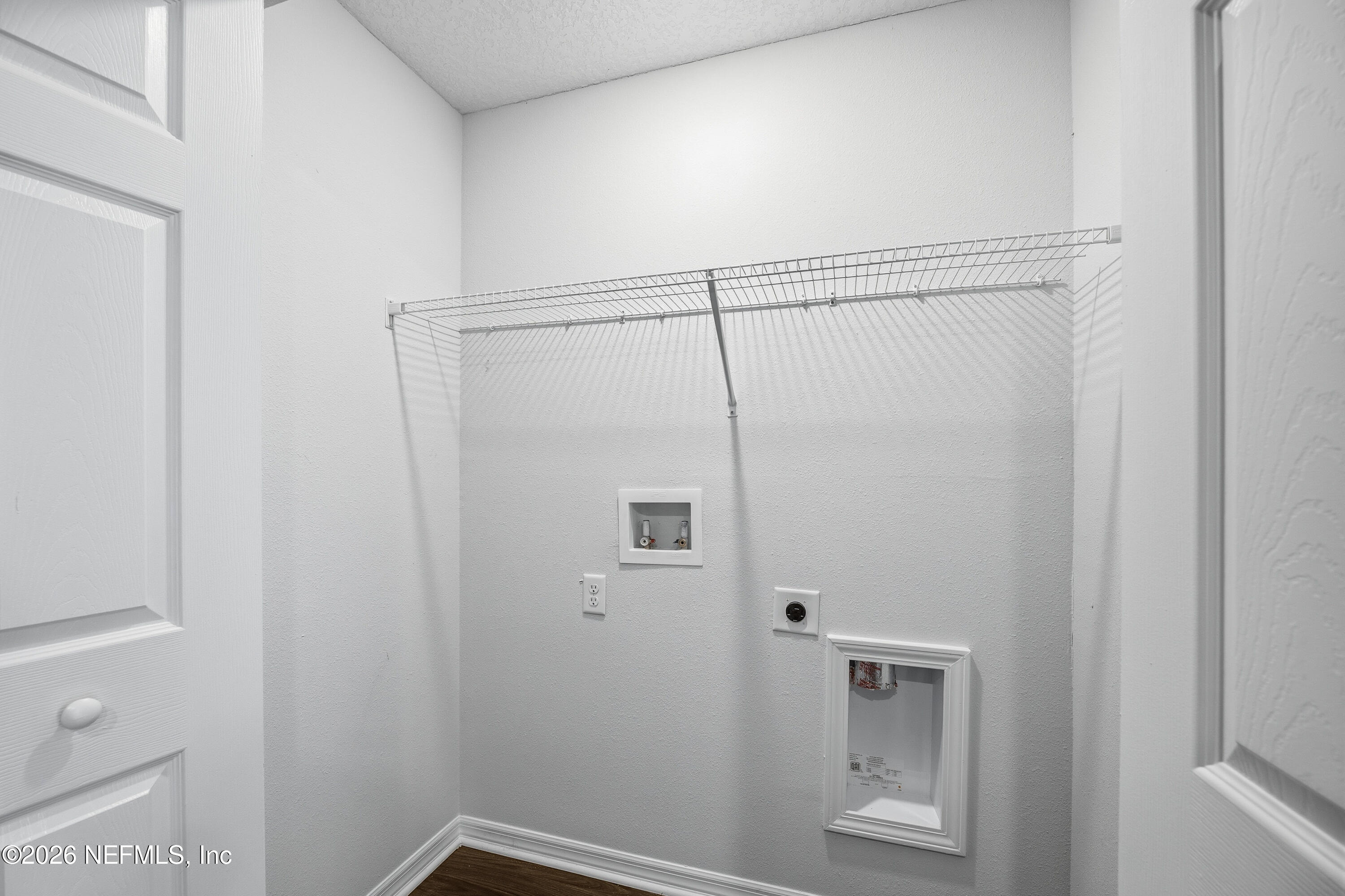 675 Moore Street Baldwin, FL 32234 - Photo 25 of 31 a bathroom with a glass shower door