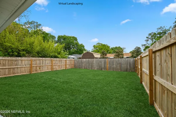 a view of a backyard with plants