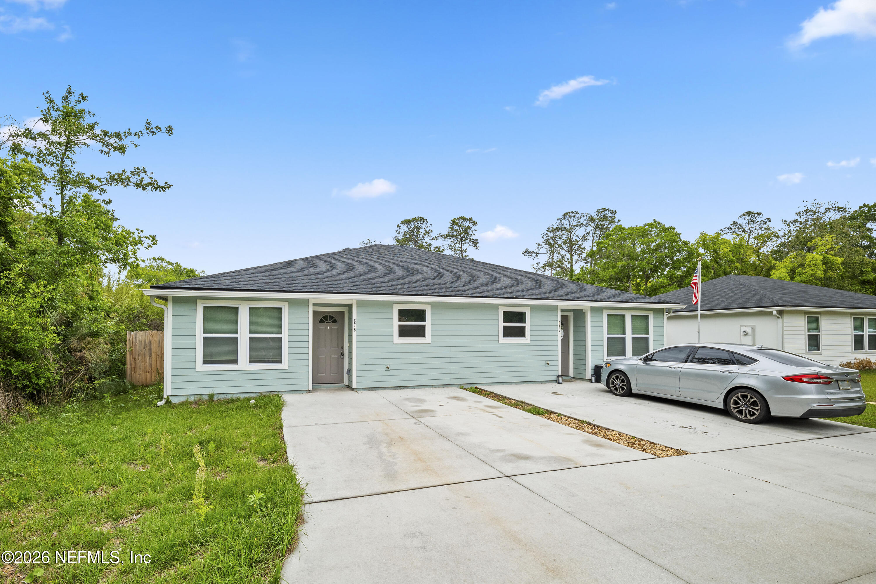 675 Moore Street Baldwin, FL 32234 - Photo 31 of 31 a front view of a house with a garden