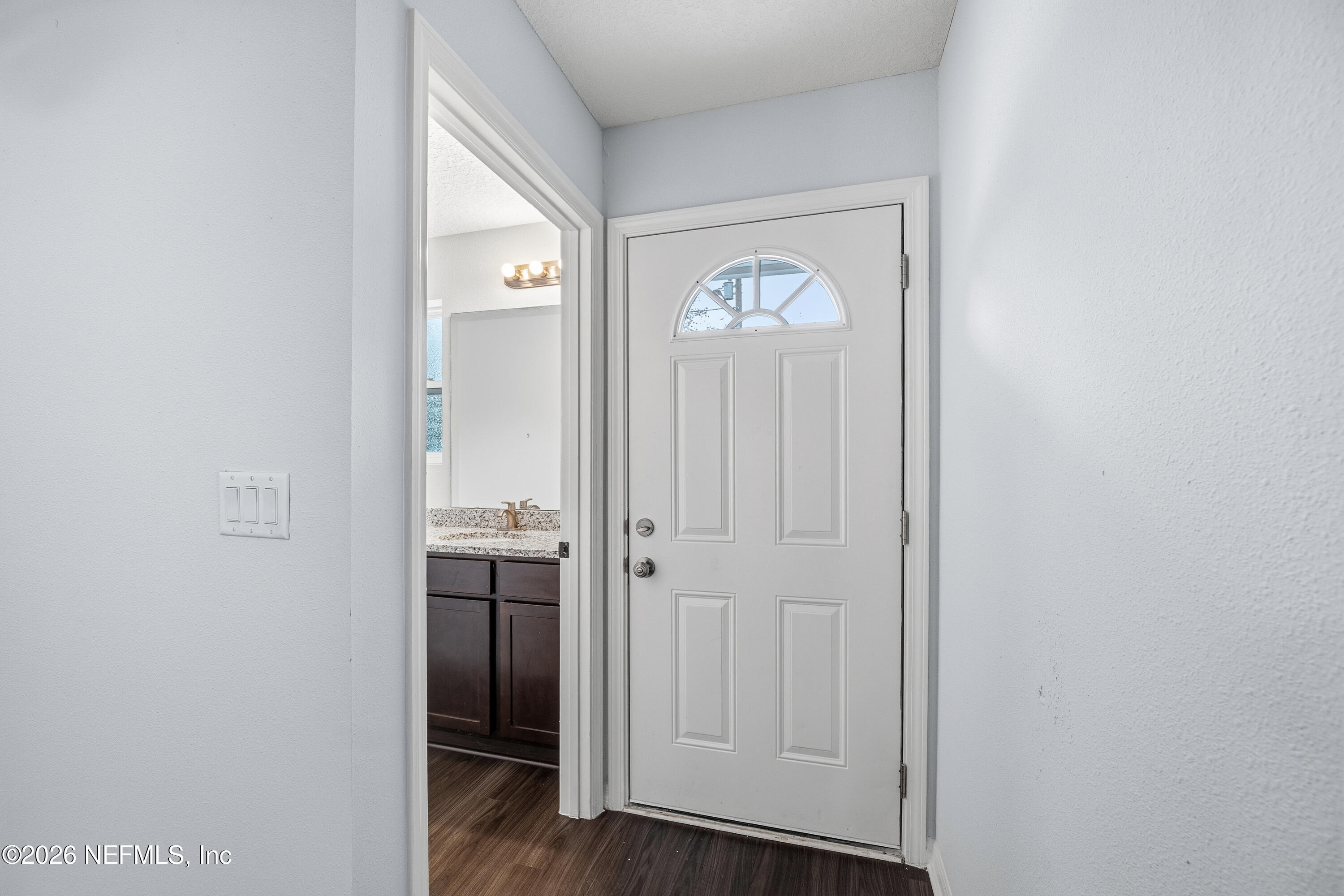 675 Moore Street Baldwin, FL 32234 - Photo 9 of 31 a view of a hallway with wooden floor