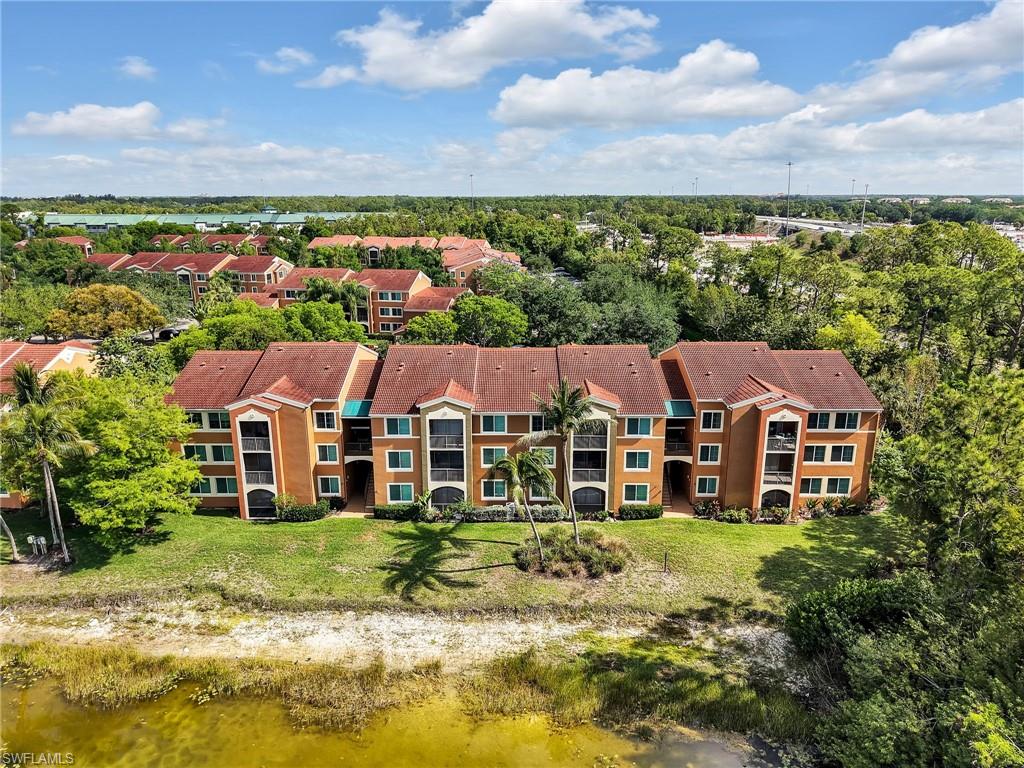 1205 Reserve Way, Unit 302 Naples, FL 34105 - Photo 26 of 31 an aerial view of residential houses and city street