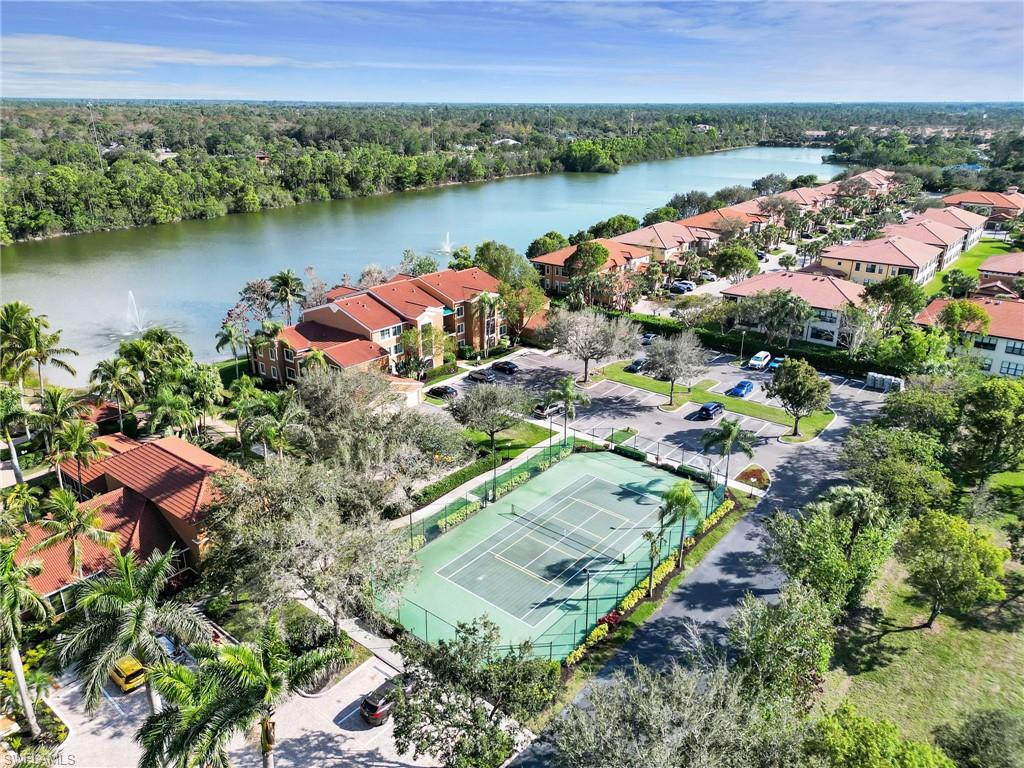 1205 Reserve Way, Unit 302 Naples, FL 34105 - Photo 28 of 31 an aerial view of a houses with a lake view
