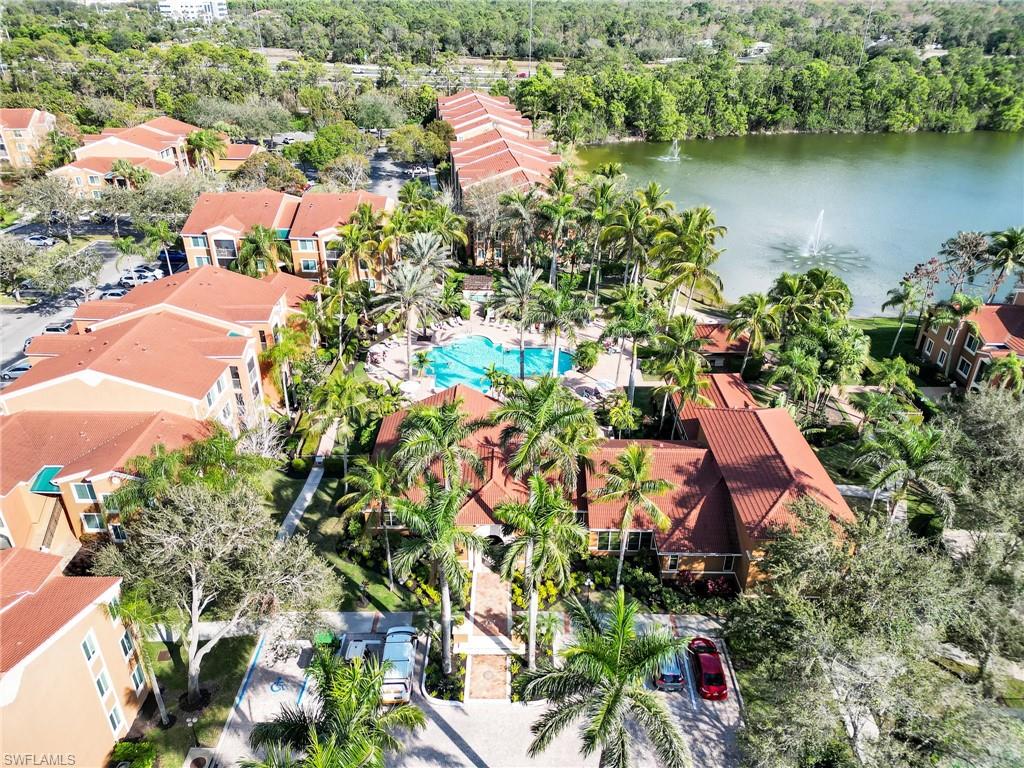 1205 Reserve Way, Unit 302 Naples, FL 34105 - Photo 29 of 31 an aerial view of residential house with outdoor space and lake view