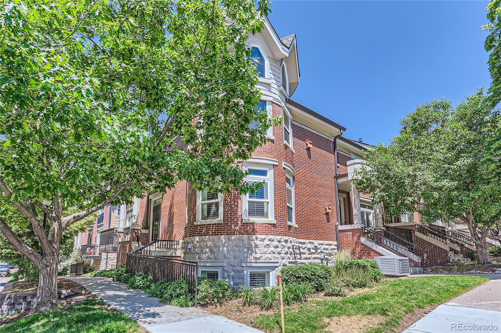 front view of a house with a tree