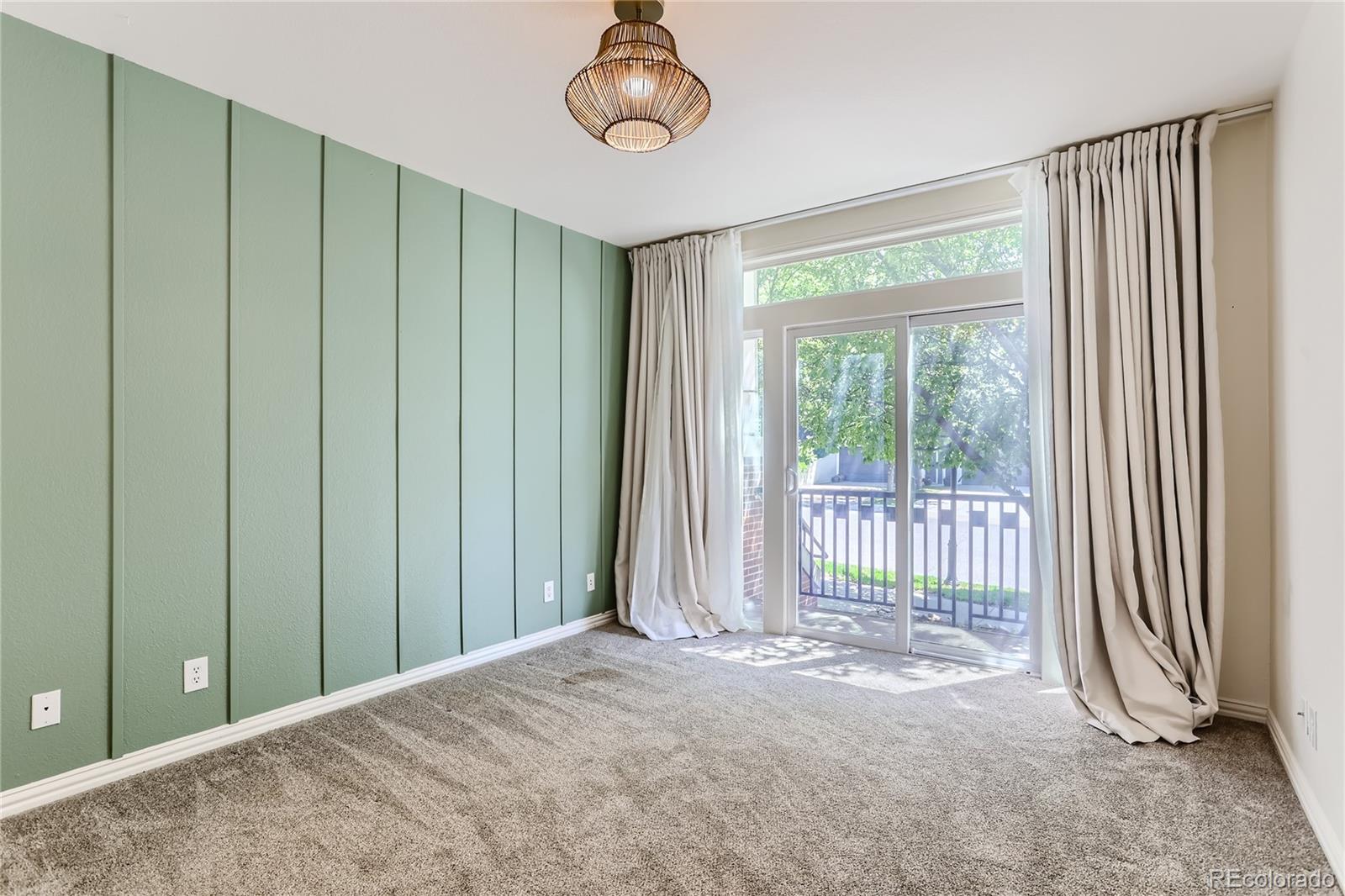 15 Jackson Street, Unit A Denver, CO 80206 - Photo 13 of 17 a view of a room with balcony and furniture