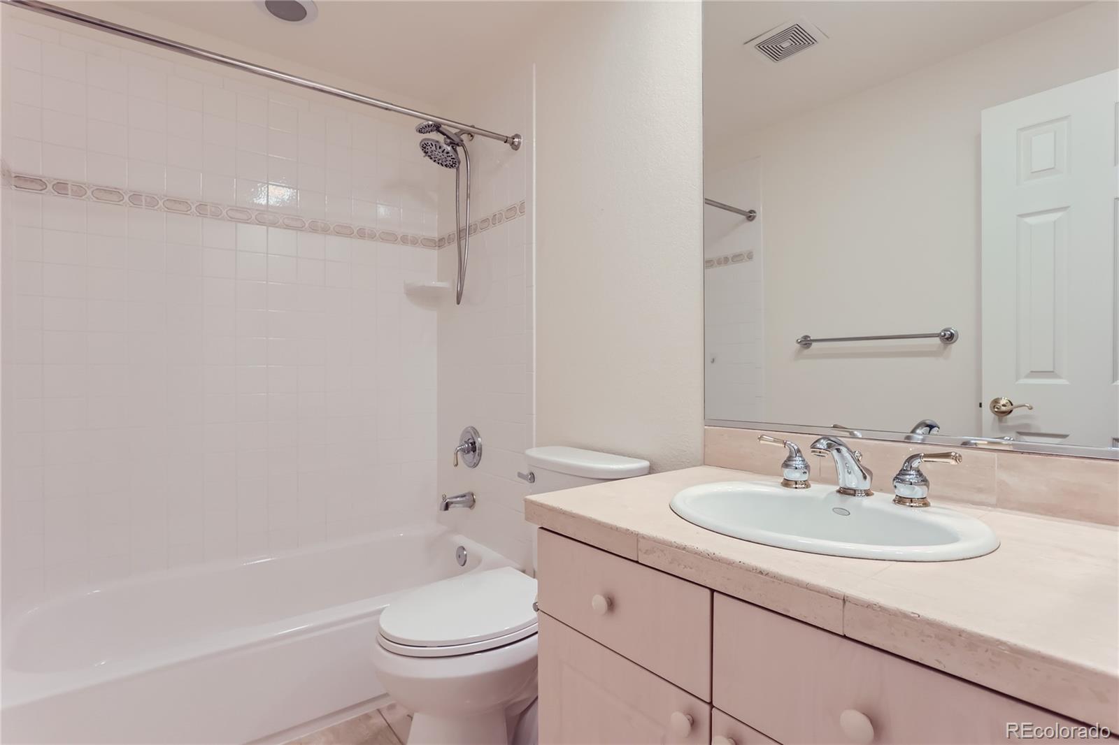 15 Jackson Street, Unit A Denver, CO 80206 - Photo 14 of 17 a bathroom with a sink toilet and shower
