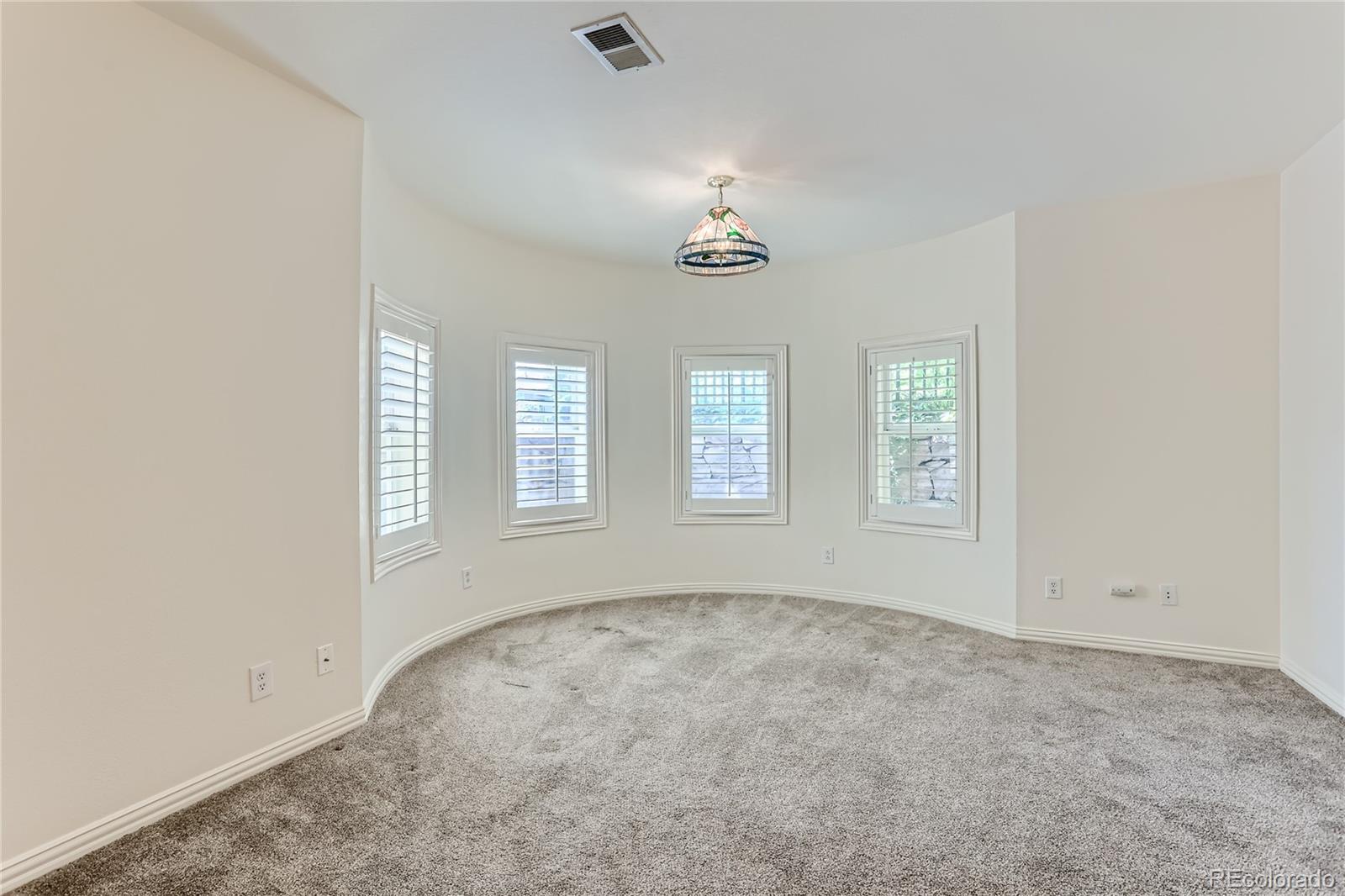15 Jackson Street, Unit A Denver, CO 80206 - Photo 15 of 17 an empty room with windows