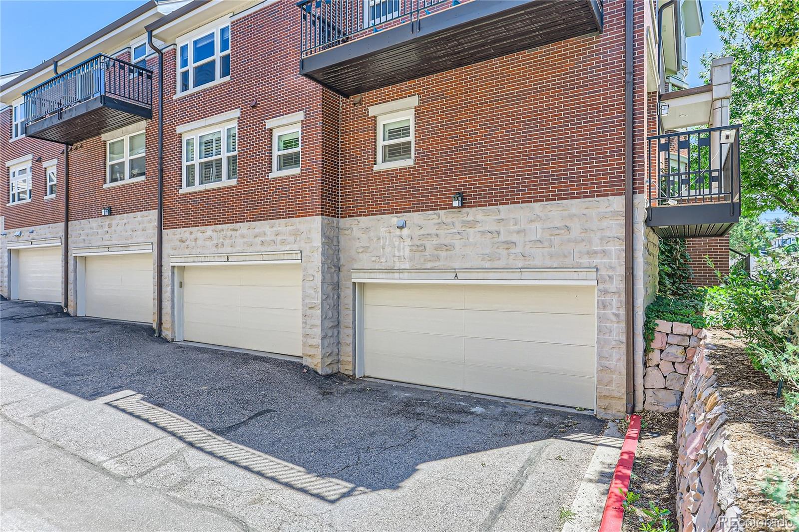 15 Jackson Street, Unit A Denver, CO 80206 - Photo 17 of 17 a front view of a house with a garage