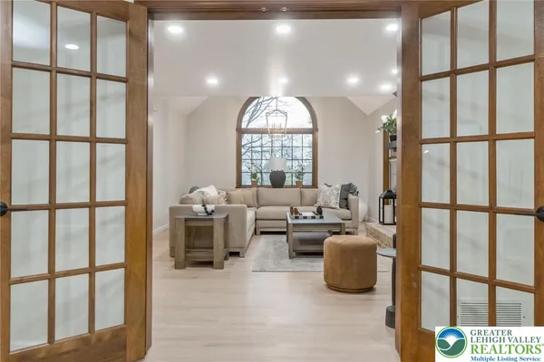 a living room with furniture and a large window
