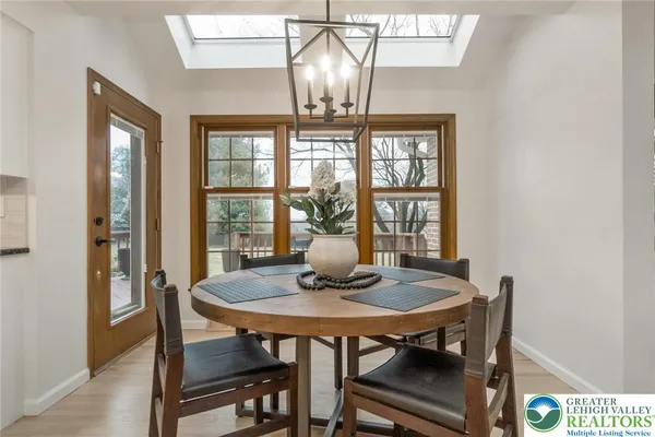 a view of a dining room with furniture window and outside view
