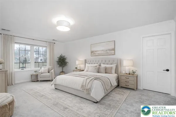 a bedroom with a large bed and a large window