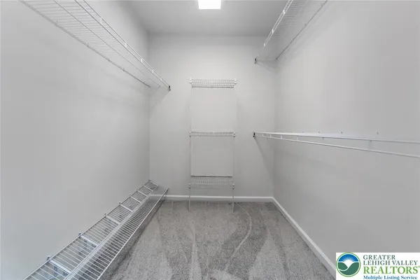 a view of a room with racks on the wall