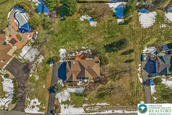 an aerial view of waterside residential houses with outdoor space