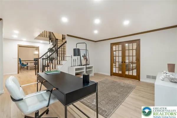 a view of a livingroom with furniture and workspace