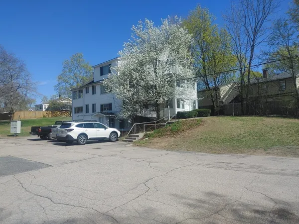 a view of street with parked cars
