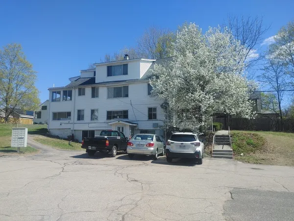 a car parked in front of a house