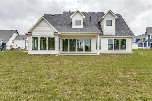front view of a house with a garden