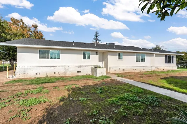 front view of a house with a yard