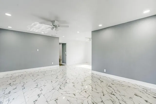 a view of a big room with wooden floor and cabinet