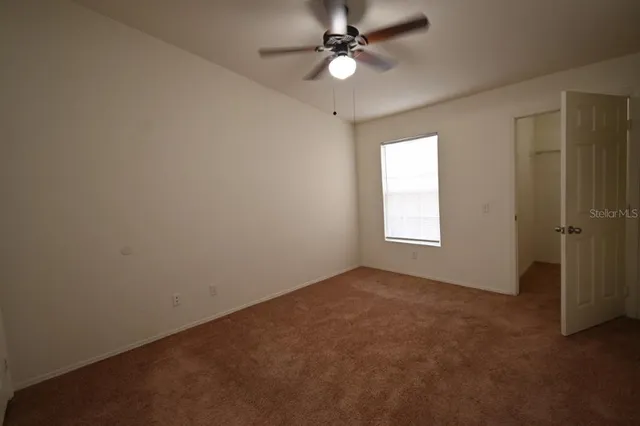 an empty room and window in a room