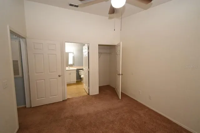 a white toilet sitting next to a bath tub