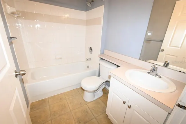 a bathroom with a sink a toilet and a bathtub