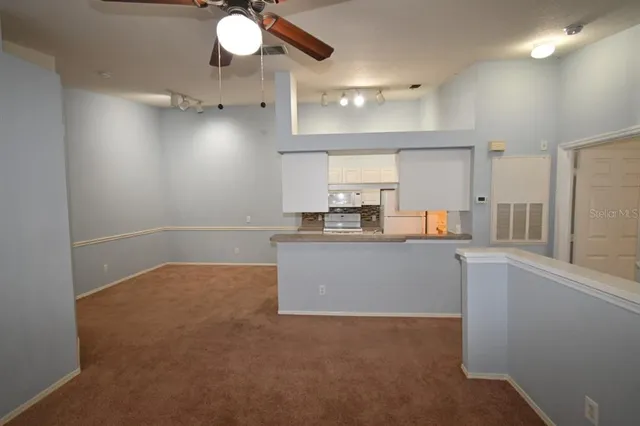 a kitchen with a stove and a refrigerator