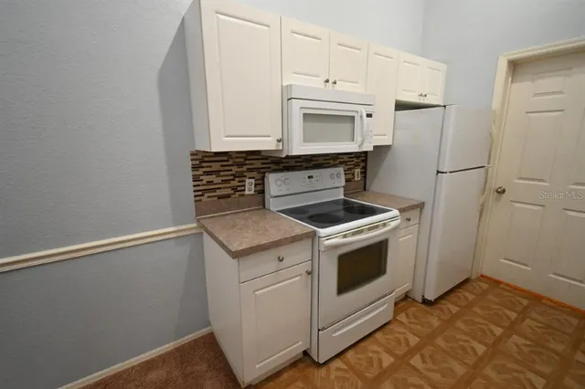 a kitchen with a stove and a sink