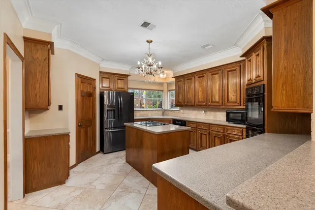 a kitchen with a sink stove and refrigerator