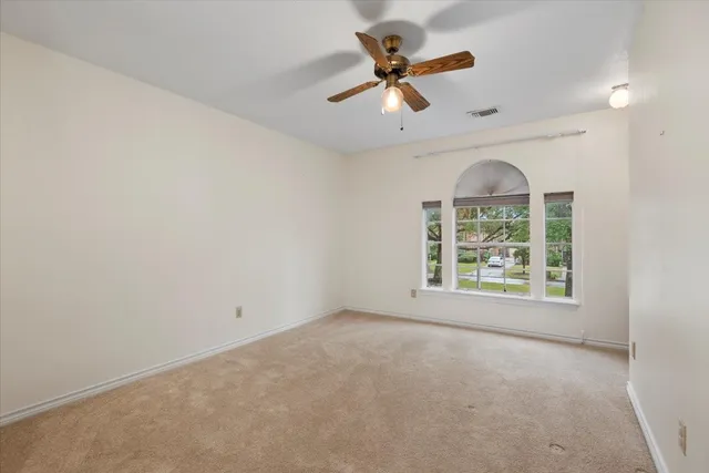 a bathroom with a sink vanity granite and a mirror