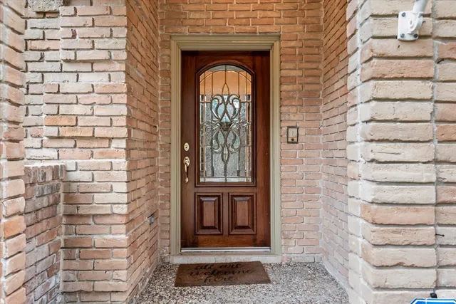 a view of a brick house with front door