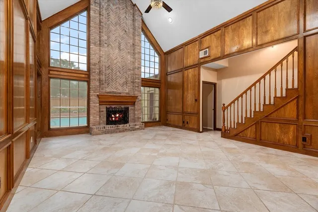 a view of an empty room with a fireplace