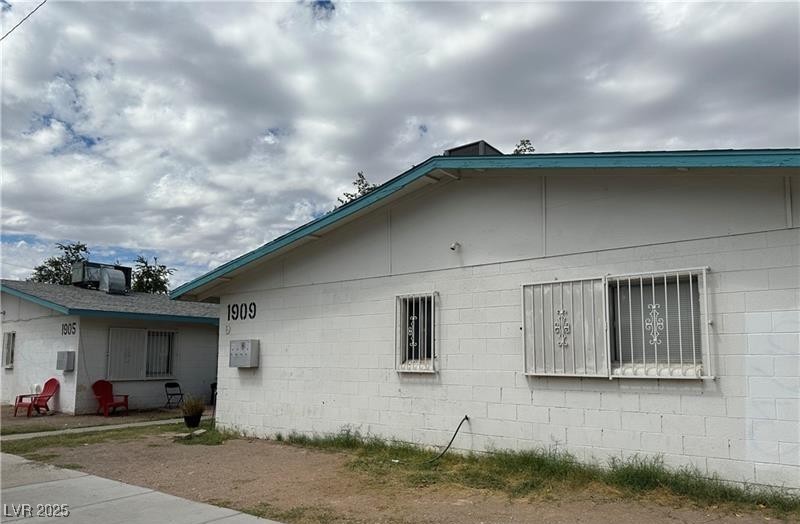 1909 Alwill Street, Unit C Las Vegas, NV 89106 - Photo 1 of 9 View of side of property featuring concrete block siding