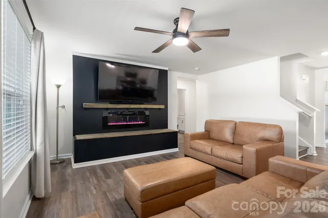 a living room with furniture and a flat screen tv