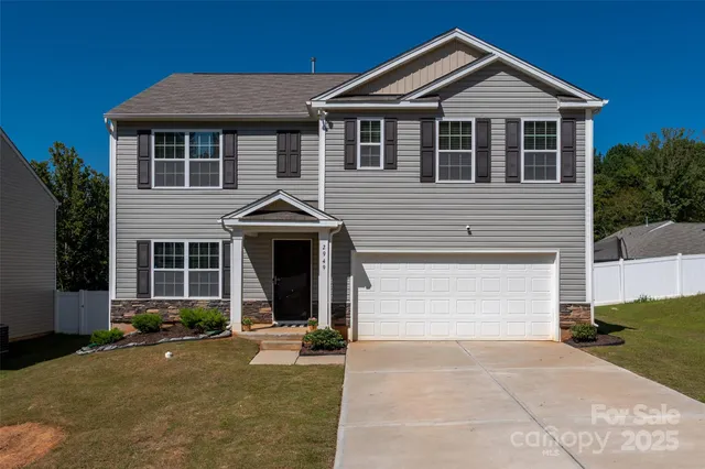a front view of a house with yard